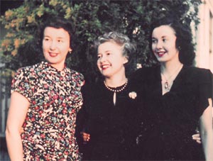 Faded color photo of the three daughters of Chester Spencer and Bessie Buzby Spencer. From the left is Betty Spencer, Lois Bryant, and Margaret Spencer.