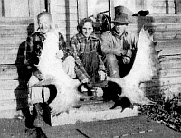Photo of Ted, Clara and Bob displaying large moose horns