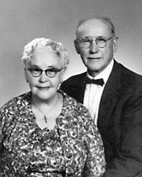 Formal portrait of Bessie Buzby Spencer and Chester Spencer, on their 50th wedding anniversary